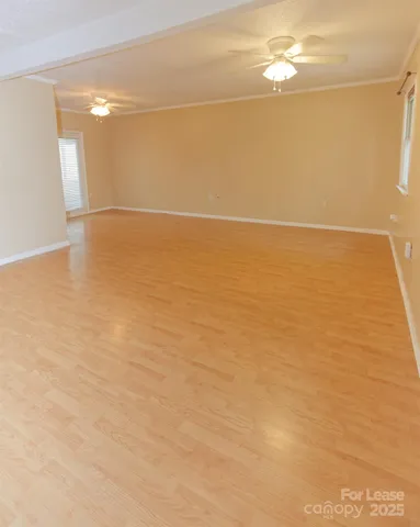 an empty room with a empty space and a window