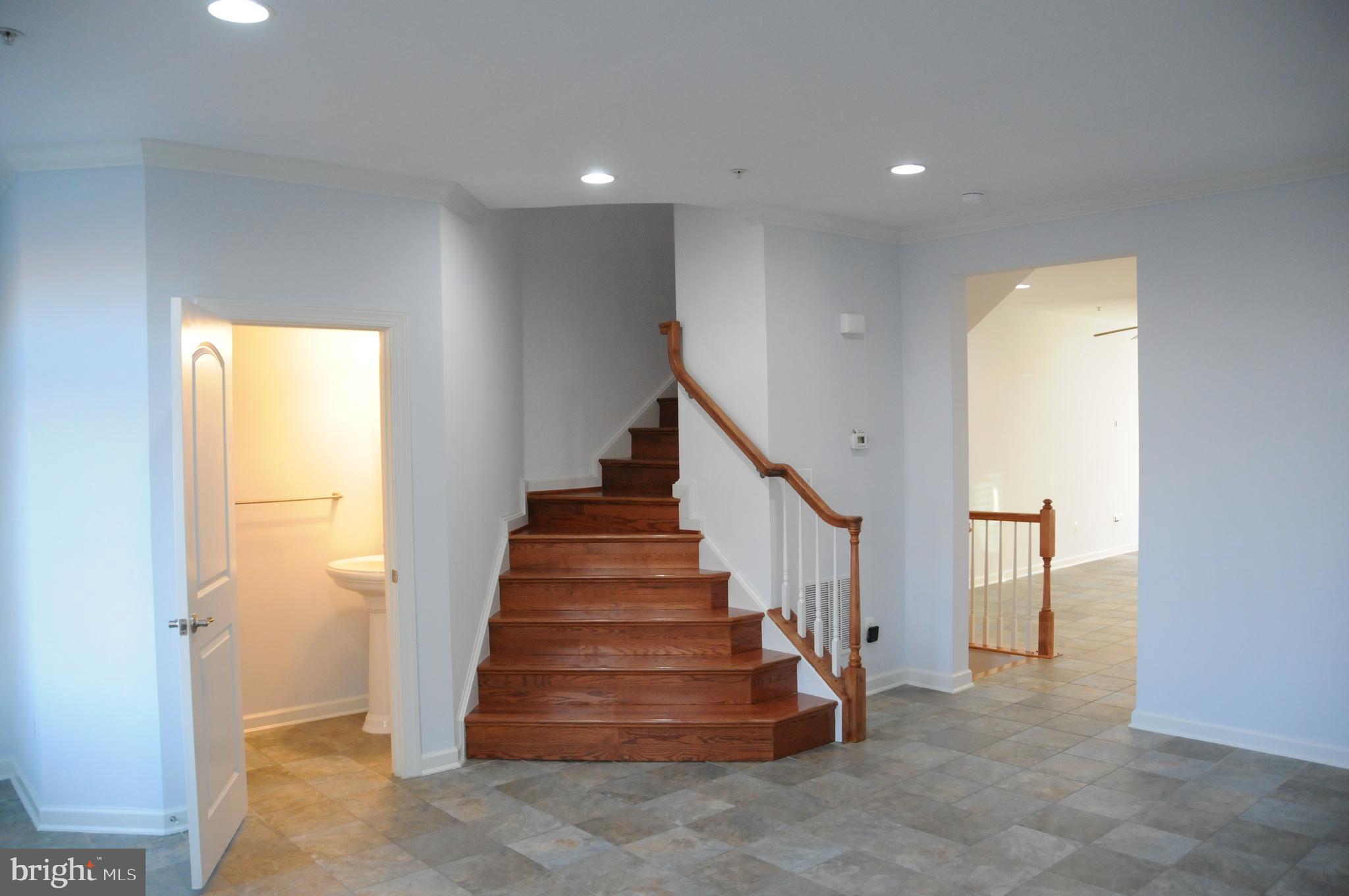 336 Grand Street Gaithersburg, MD 20878 - Photo 20 of 28 Oak Stair Case from Kitchen Area /Half BA