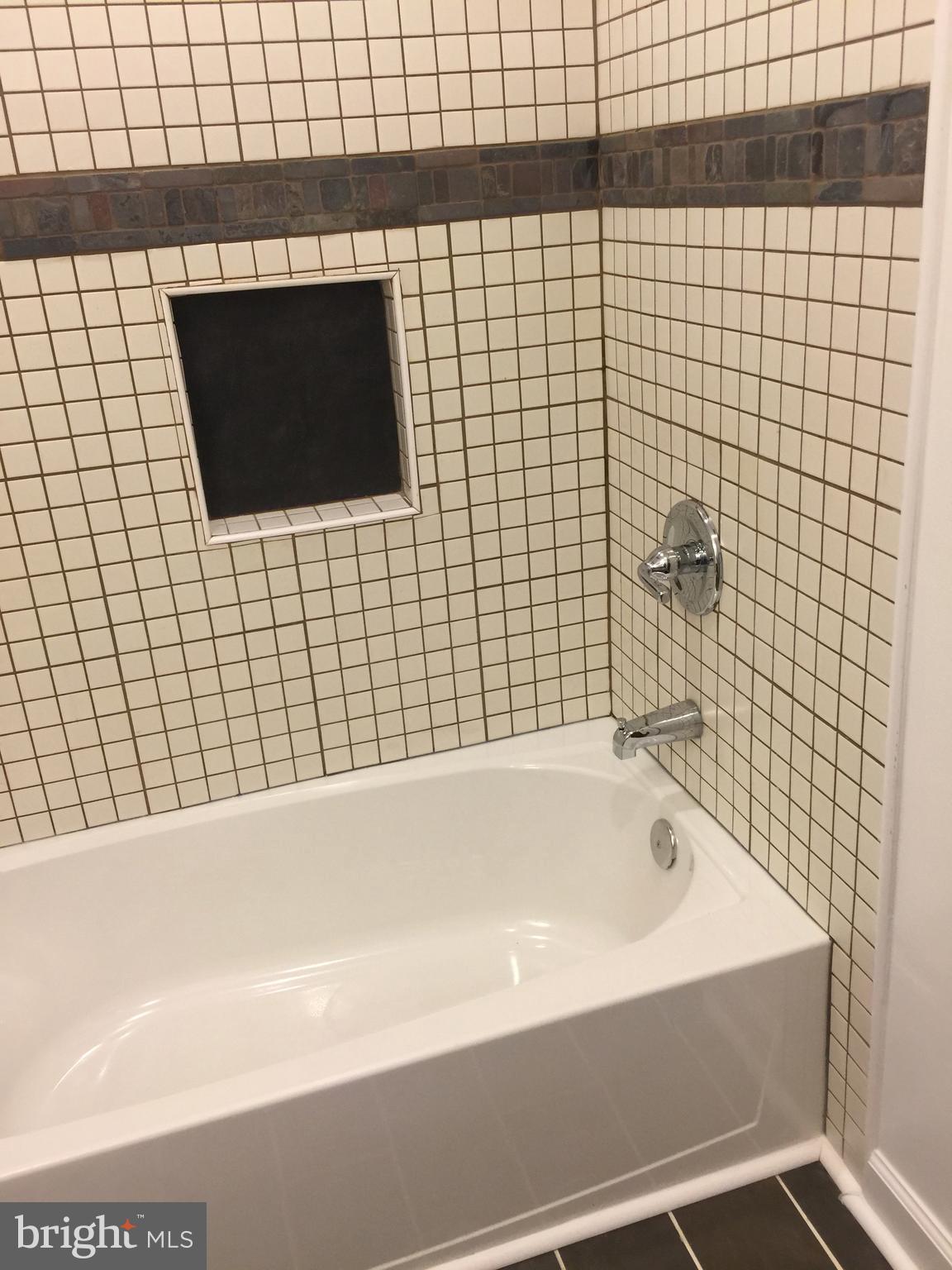 1049 Desoto Road Baltimore, MD 21223 - Photo 40 of 47 a bathroom with a bathtub and a shower
