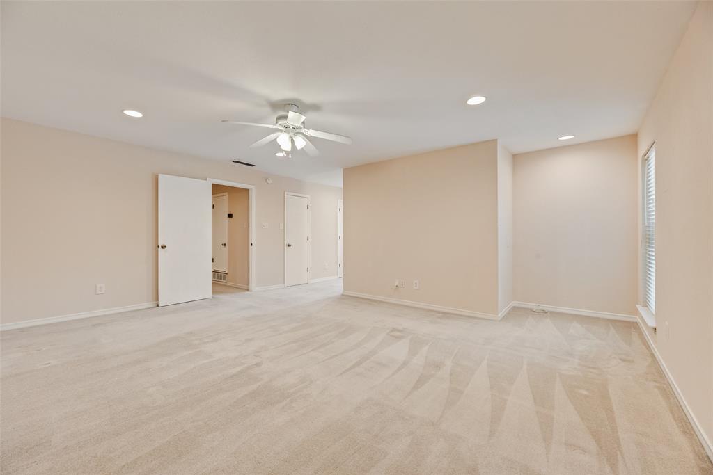 4988 Thunder Road Dallas, TX 75244 - Photo 17 of 32 Spacious carpeted room featuring a ceiling fan, recessed lighting, and multiple windows with blinds