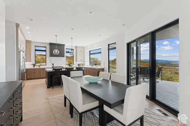 2280 East Outlaw Road, Unit 56 Kamas, UT 84036 - Photo 16 of 59 Dining room featuring light wood-style flooring and recessed lighting
