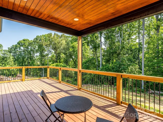 a balcony with wooden floor