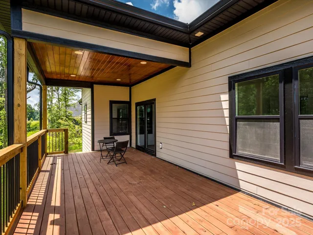 a view of two chairs in the balcony