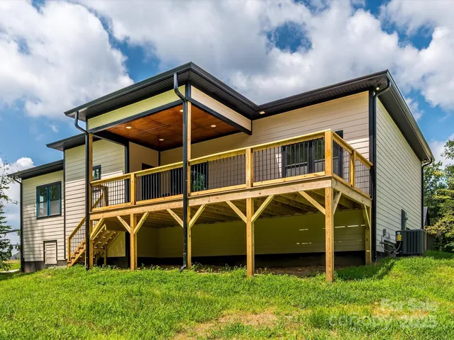 a view of a backyard with plants and a small yard