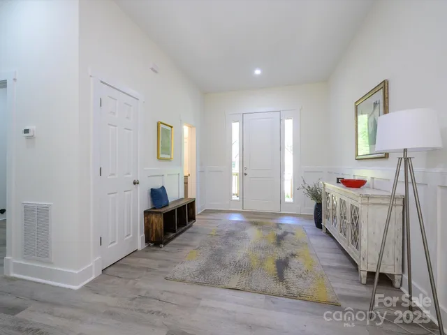 a bedroom with furniture and a window