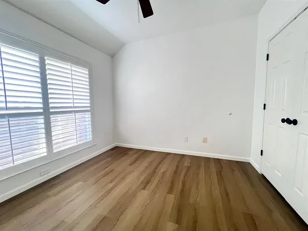 a bathroom with a sink vanity and mirror