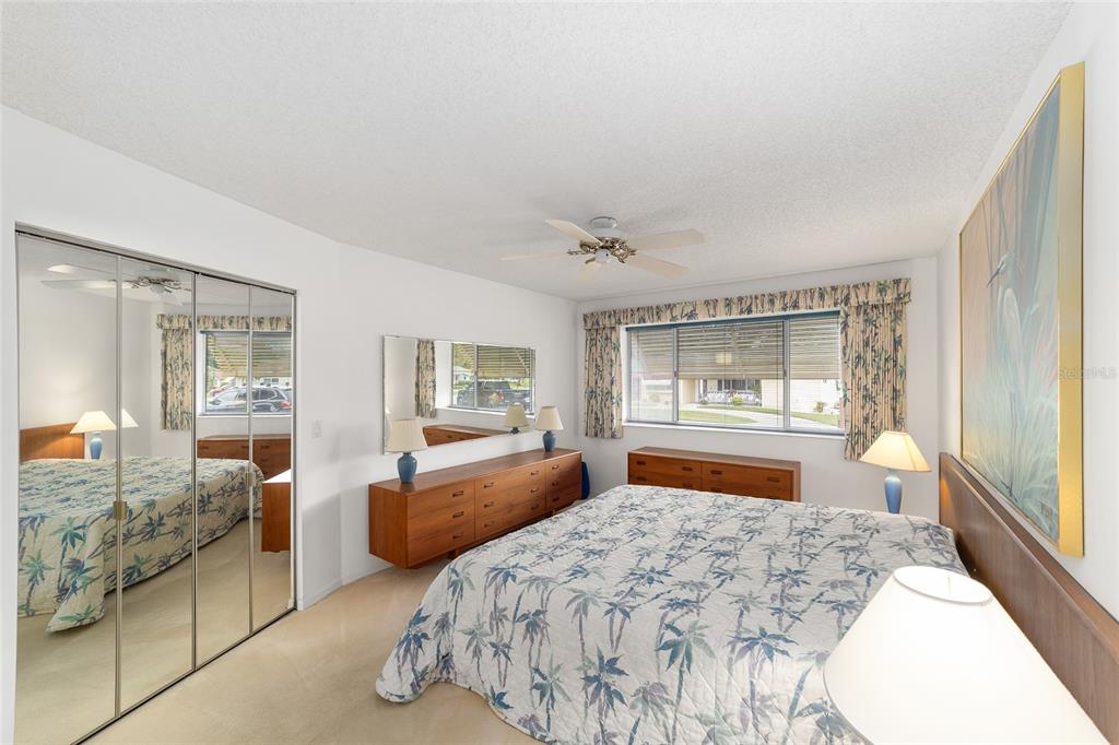 10984 Southwest 82nd Terrace Ocala, FL 34481 - Photo 22 of 40 a bedroom with furniture and large windows