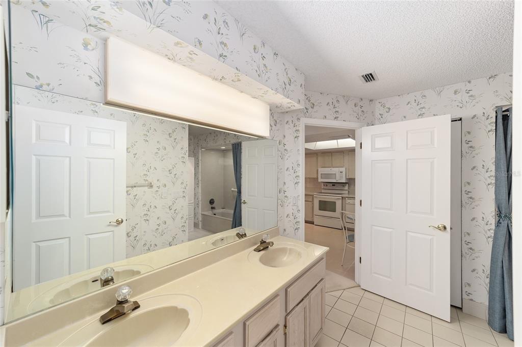 10984 Southwest 82nd Terrace Ocala, FL 34481 - Photo 24 of 40 a bathroom with a tub sink and mirror