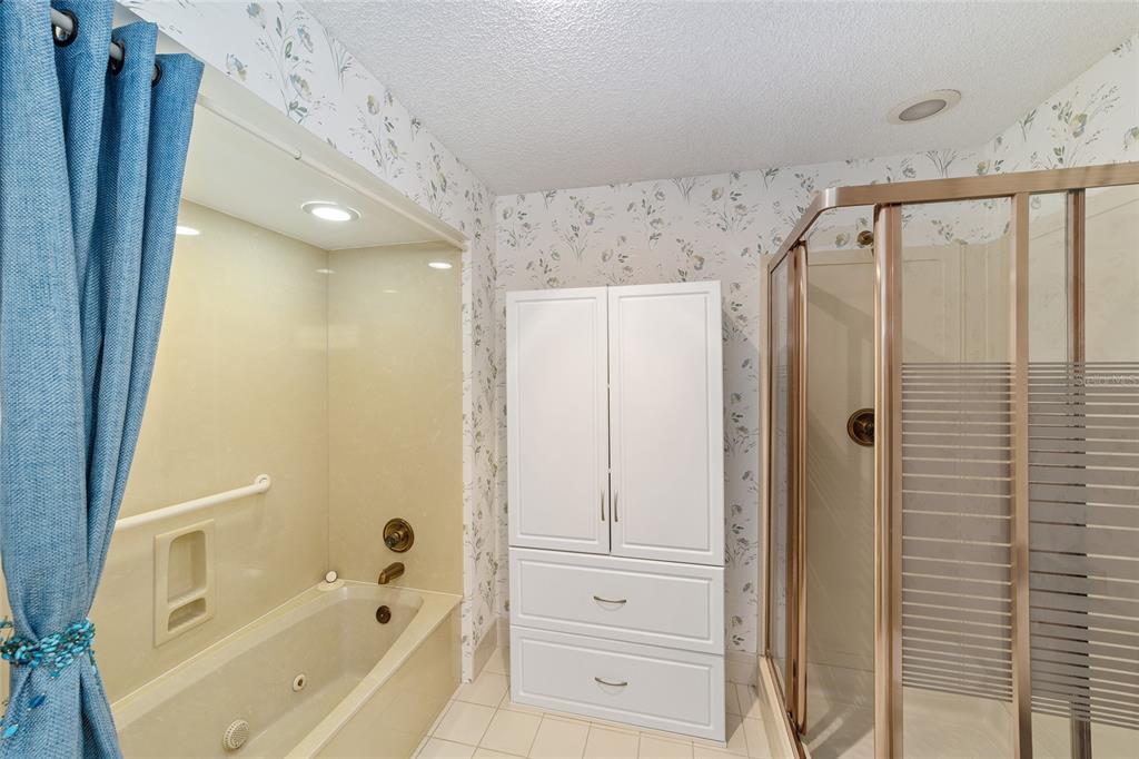 10984 Southwest 82nd Terrace Ocala, FL 34481 - Photo 25 of 40 a bathroom with a bathtub and a shower