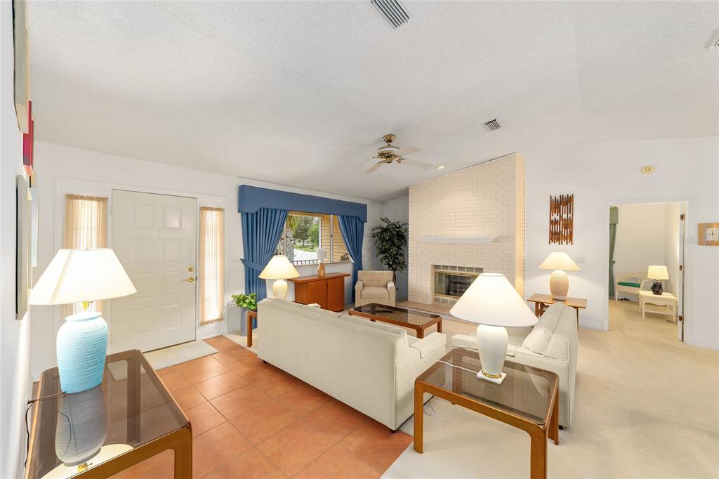 10984 Southwest 82nd Terrace Ocala, FL 34481 - Photo 4 of 40 a living room with furniture and a lamp