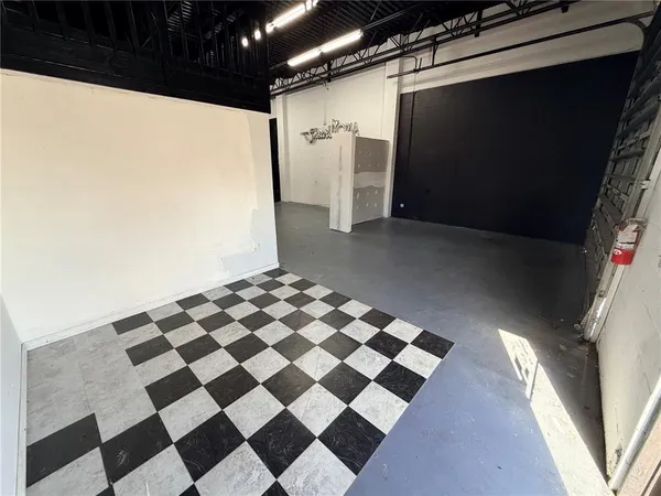 a view of a living room with a black white checkered floor