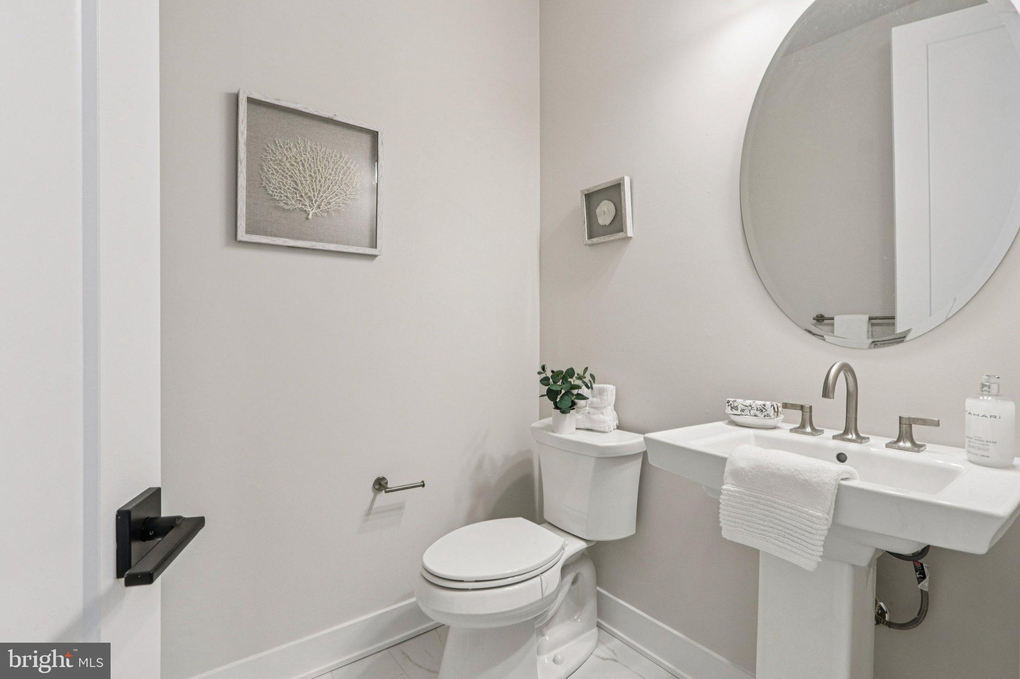 127 Alroy Road Malvern, PA 19355 - Photo 10 of 53 a bathroom with a toilet sink and mirror