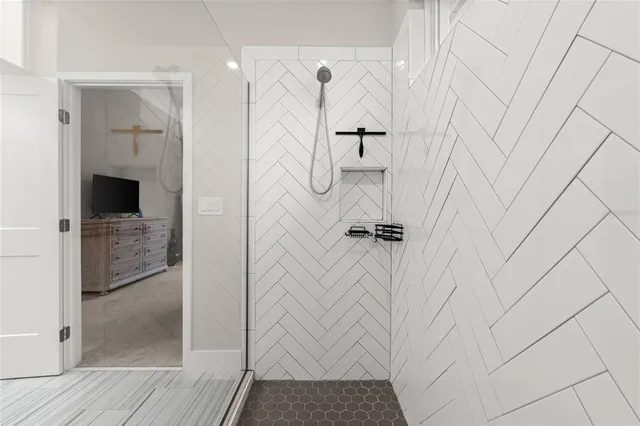 a bathroom with a shower and a sink