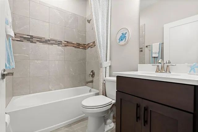 a bathroom with a sink a toilet and a bathtub