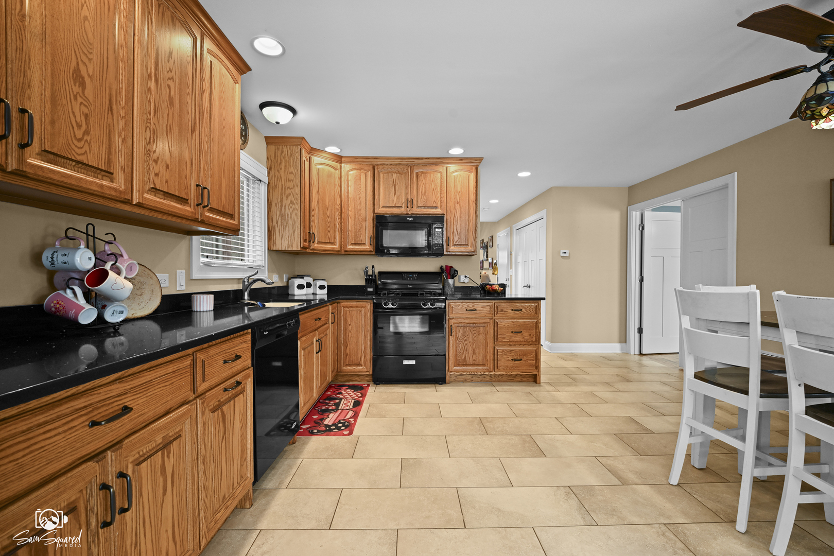 32 Largemouth Lane Wilmington, IL 60481 - Photo 11 of 34 a kitchen with stainless steel appliances granite countertop a stove top oven a sink dishwasher and cabinets with wooden floor