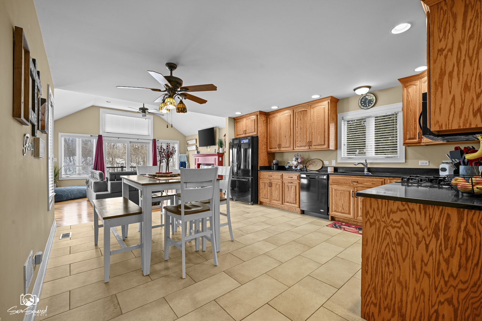 32 Largemouth Lane Wilmington, IL 60481 - Photo 18 of 45 a kitchen with stainless steel appliances kitchen island granite countertop a table chairs and a refrigerator