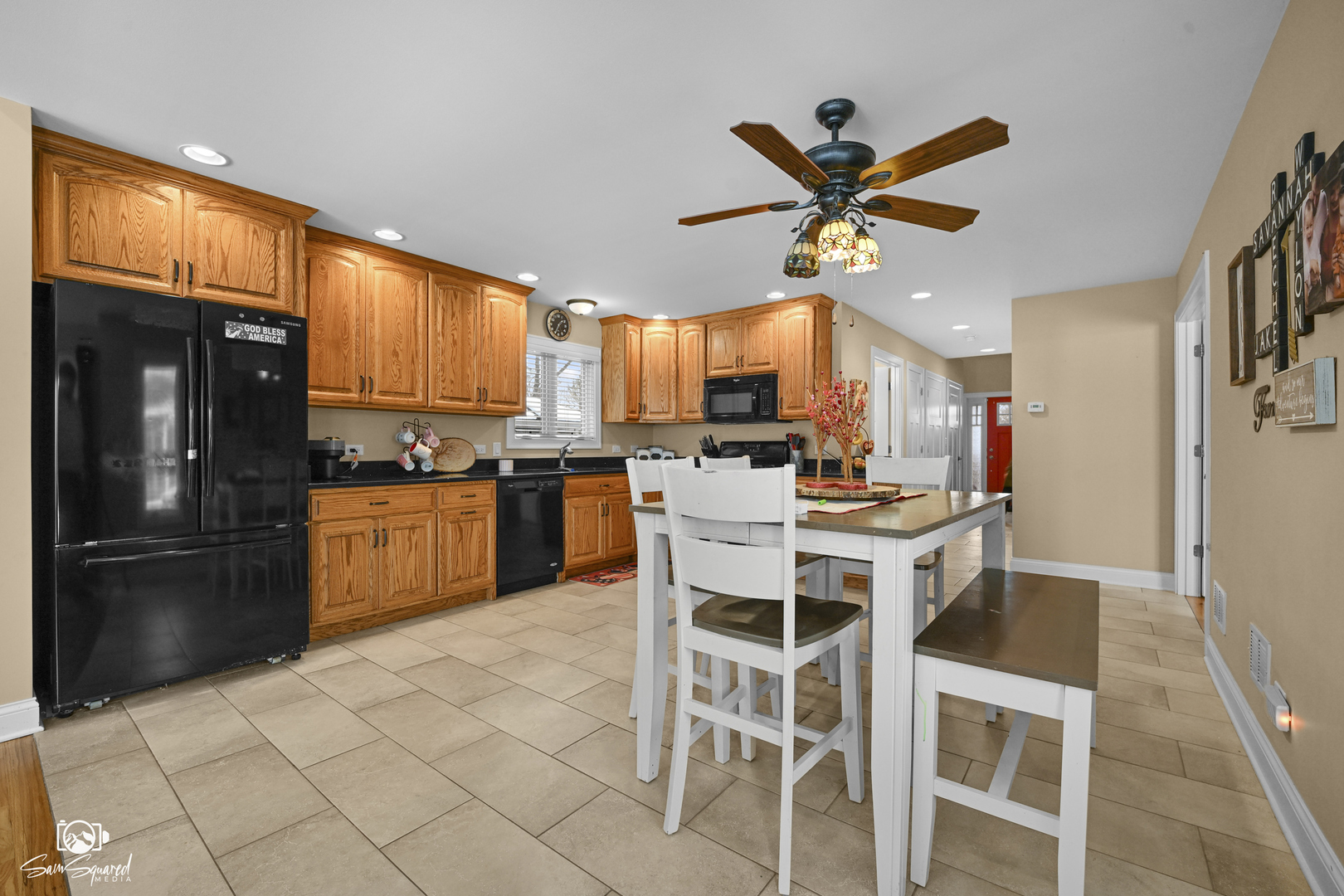 32 Largemouth Lane Wilmington, IL 60481 - Photo 19 of 45 a kitchen with stainless steel appliances kitchen island granite countertop a refrigerator a stove a sink and a dining table with white cabinets