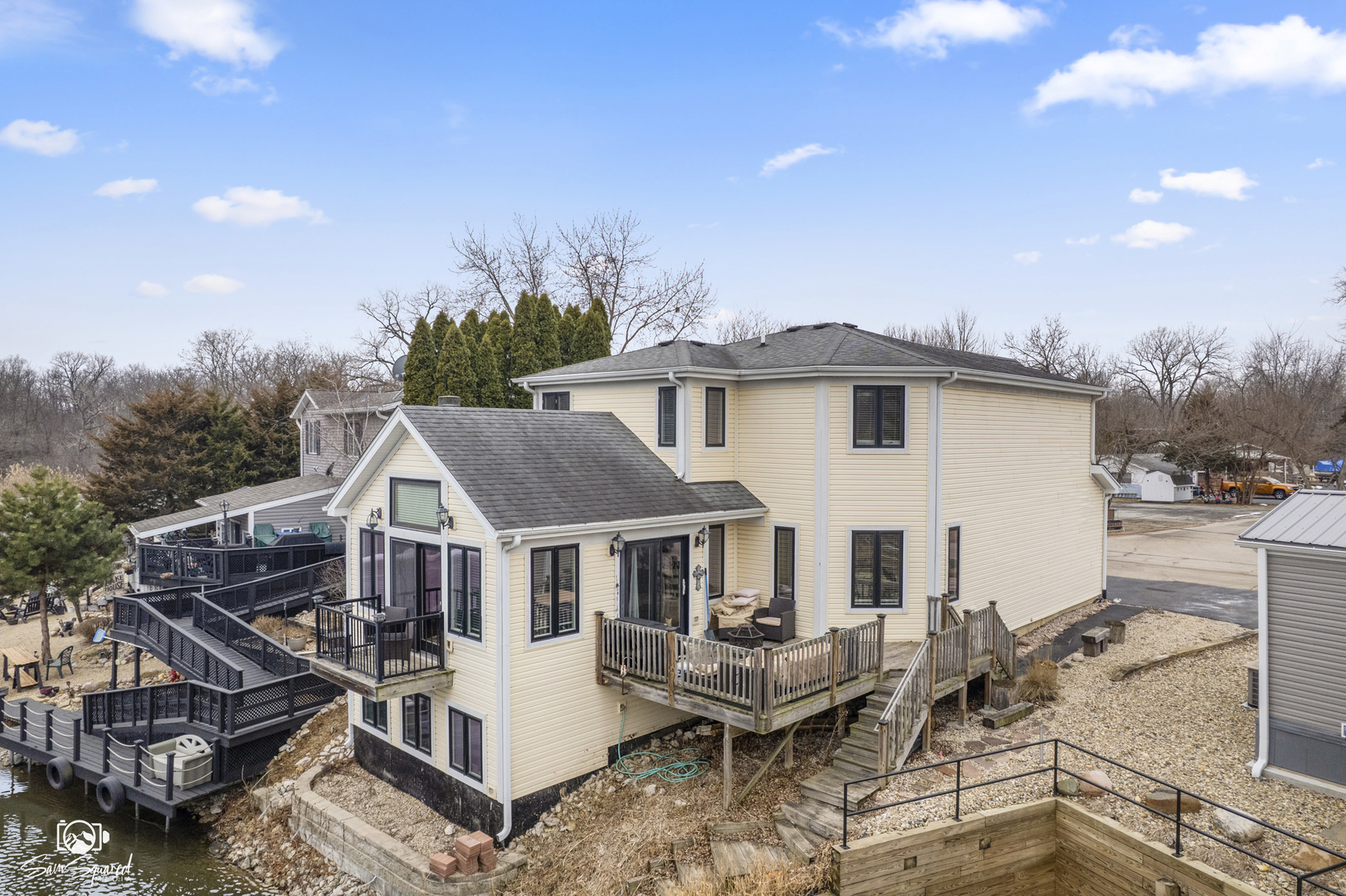 32 Largemouth Lane Wilmington, IL 60481 - Photo 5 of 34 a view of a house with wooden deck and furniture