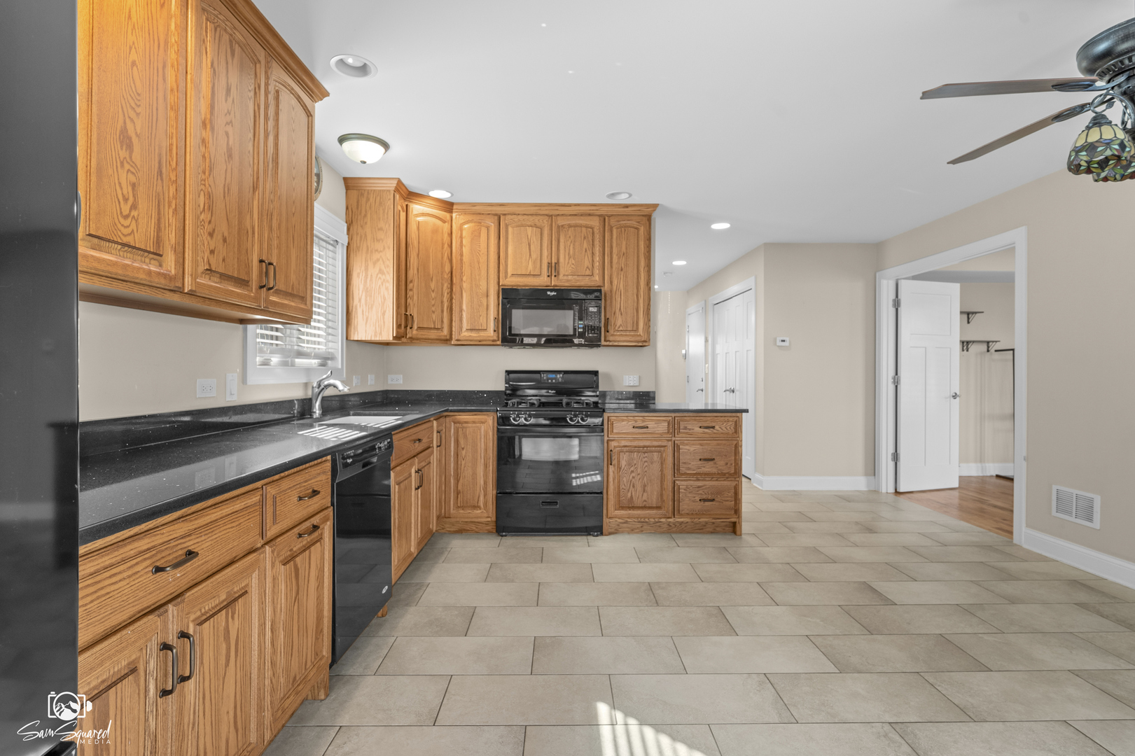 32 Largemouth Lane Wilmington, IL 60481 - Photo 9 of 45 a kitchen with stainless steel appliances granite countertop a stove a sink and a refrigerator