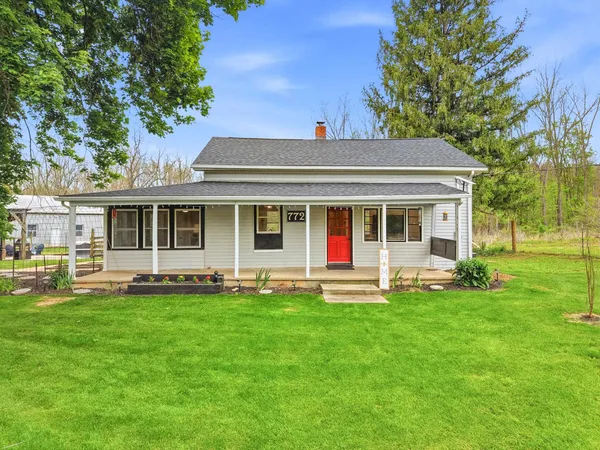 front view of a house with a yard