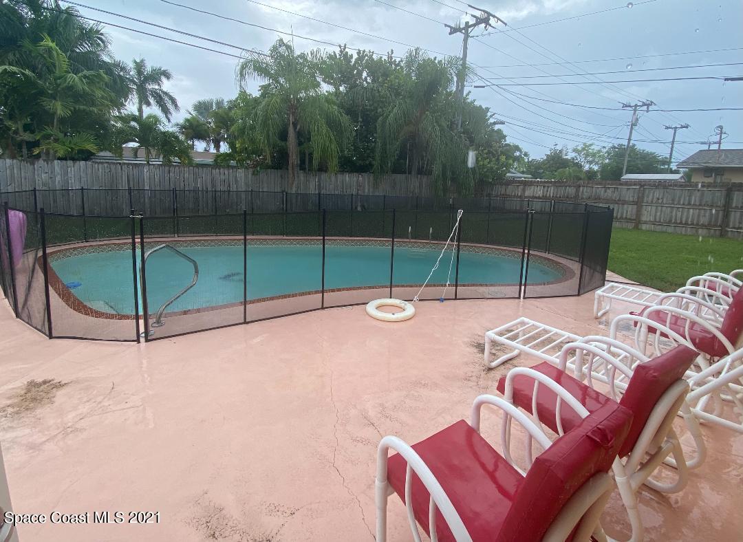 405 Rosedale Drive Satellite Beach, FL 32937 - Photo 2 of 19 pool with safety screen