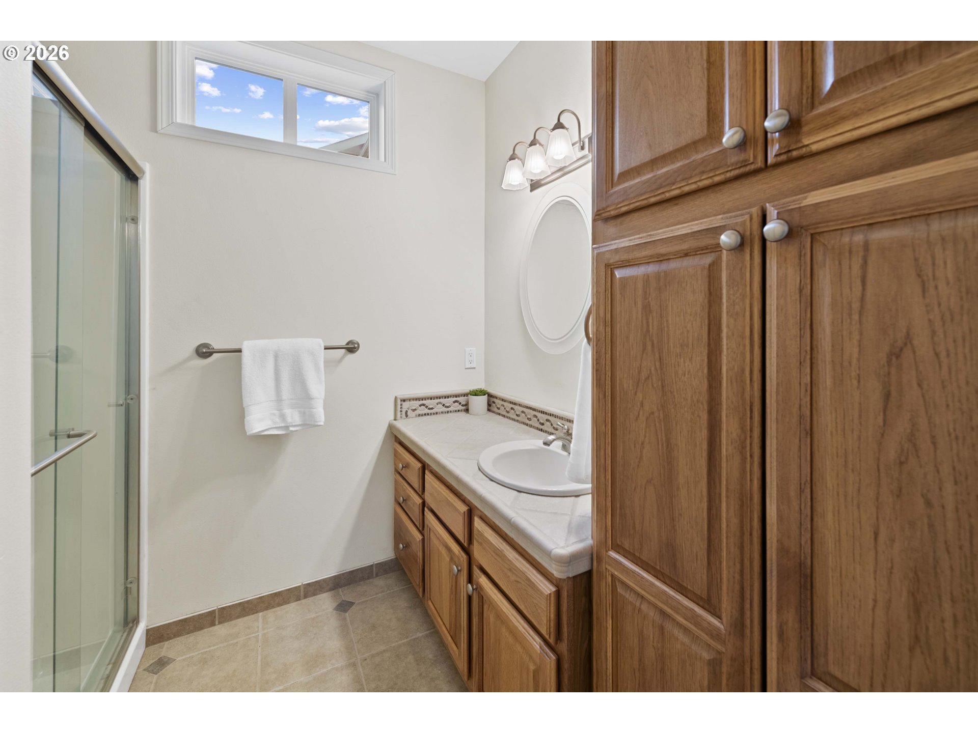 230 Round House Road Astoria, OR 97103 - Photo 17 of 43 a bathroom with a sink and mirror