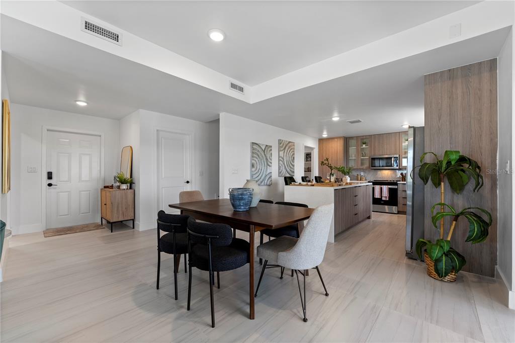 6308 Chorus Drive Mascotte, FL 34753 - Photo 11 of 24 a view of a dining room with furniture and wooden floor