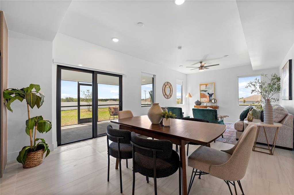 6308 Chorus Drive Mascotte, FL 34753 - Photo 20 of 24 a dining room with furniture and wooden floor