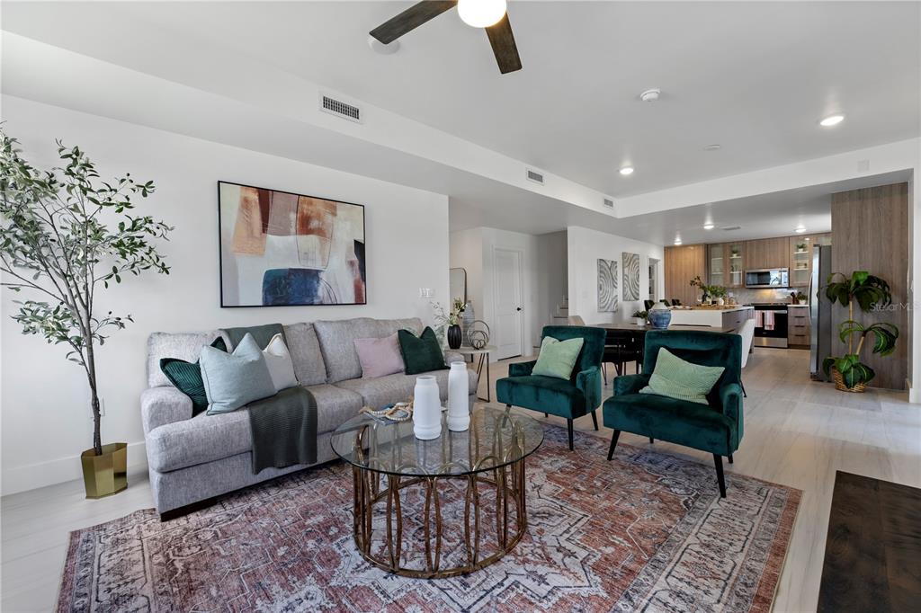 6308 Chorus Drive Mascotte, FL 34753 - Photo 5 of 24 a living room with furniture and a rug