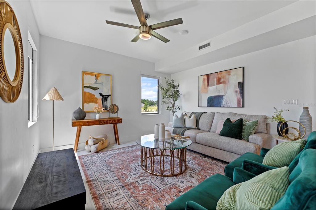 6308 Chorus Drive Mascotte, FL 34753 - Photo 8 of 24 a living room with furniture and a rug