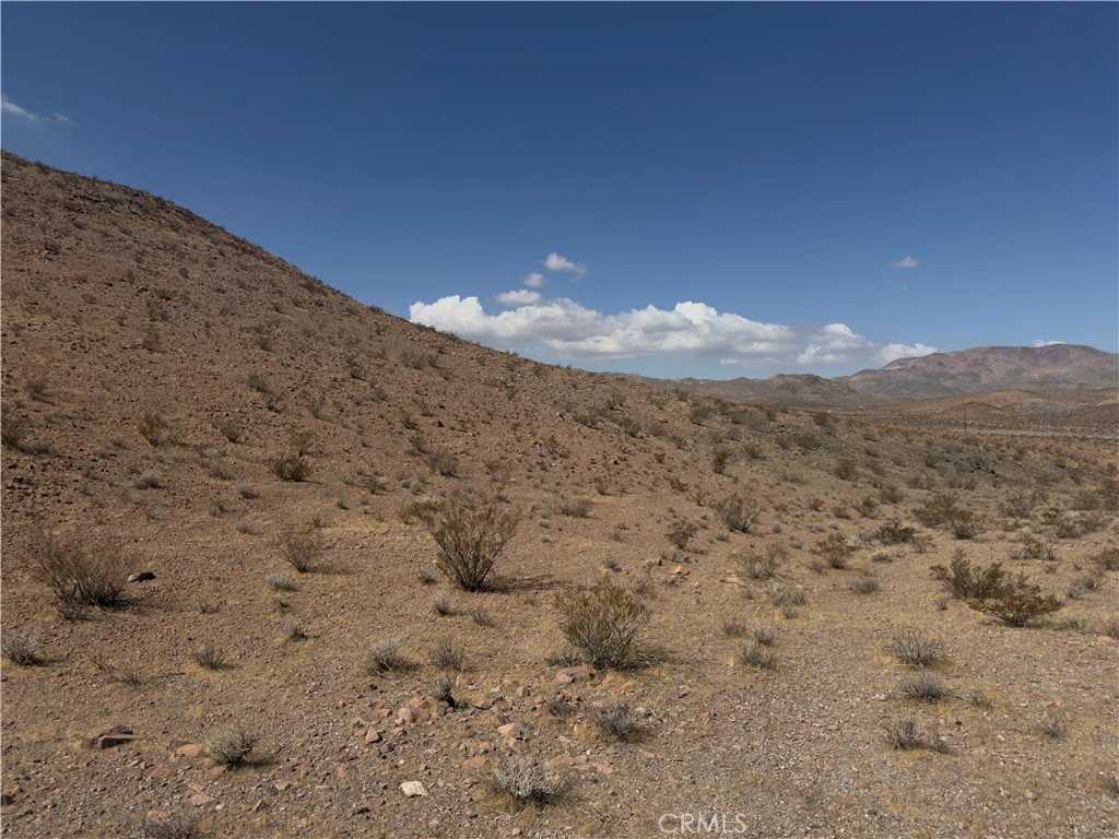29 Fort Irwin Road Yermo, CA 92398 - Photo 9 of 17 a view of a dry field with mountains in the background