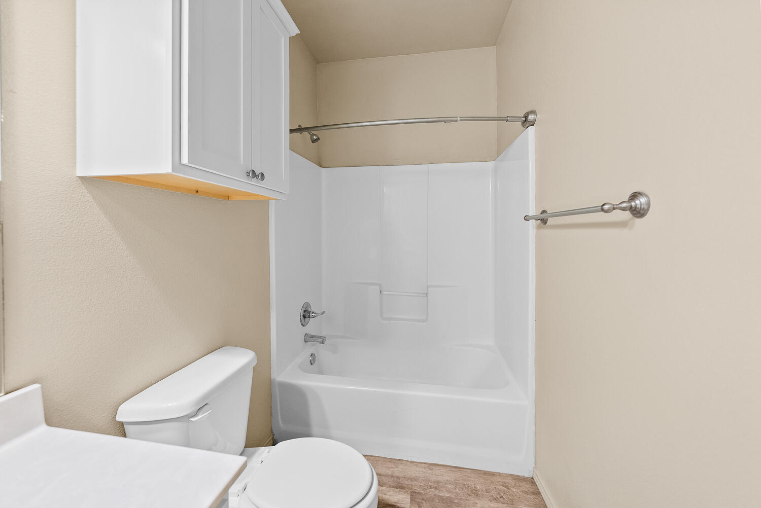 2128 10th Street Lubbock, TX 79401 - Photo 12 of 23 a bathroom with a toilet and a bathtub