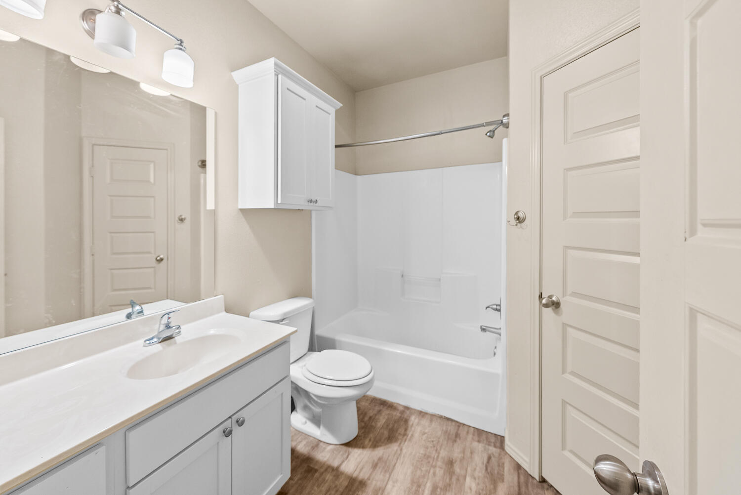 2128 10th Street Lubbock, TX 79401 - Photo 17 of 23 a bathroom with a sink toilet and shower