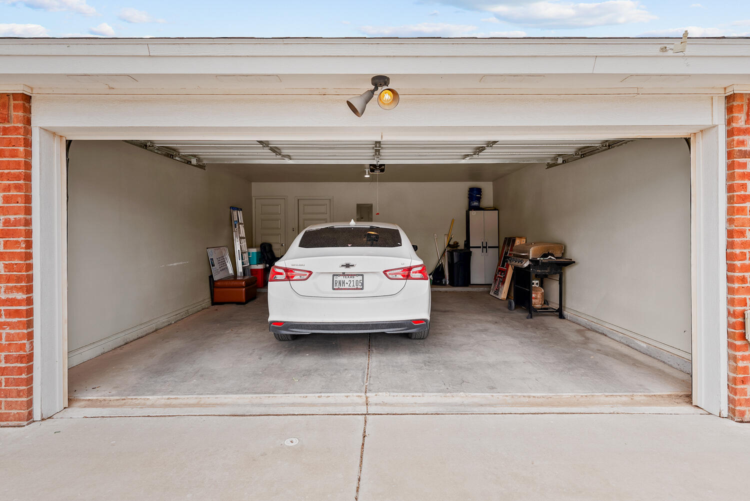 2128 10th Street Lubbock, TX 79401 - Photo 21 of 23 a car parked in a garage