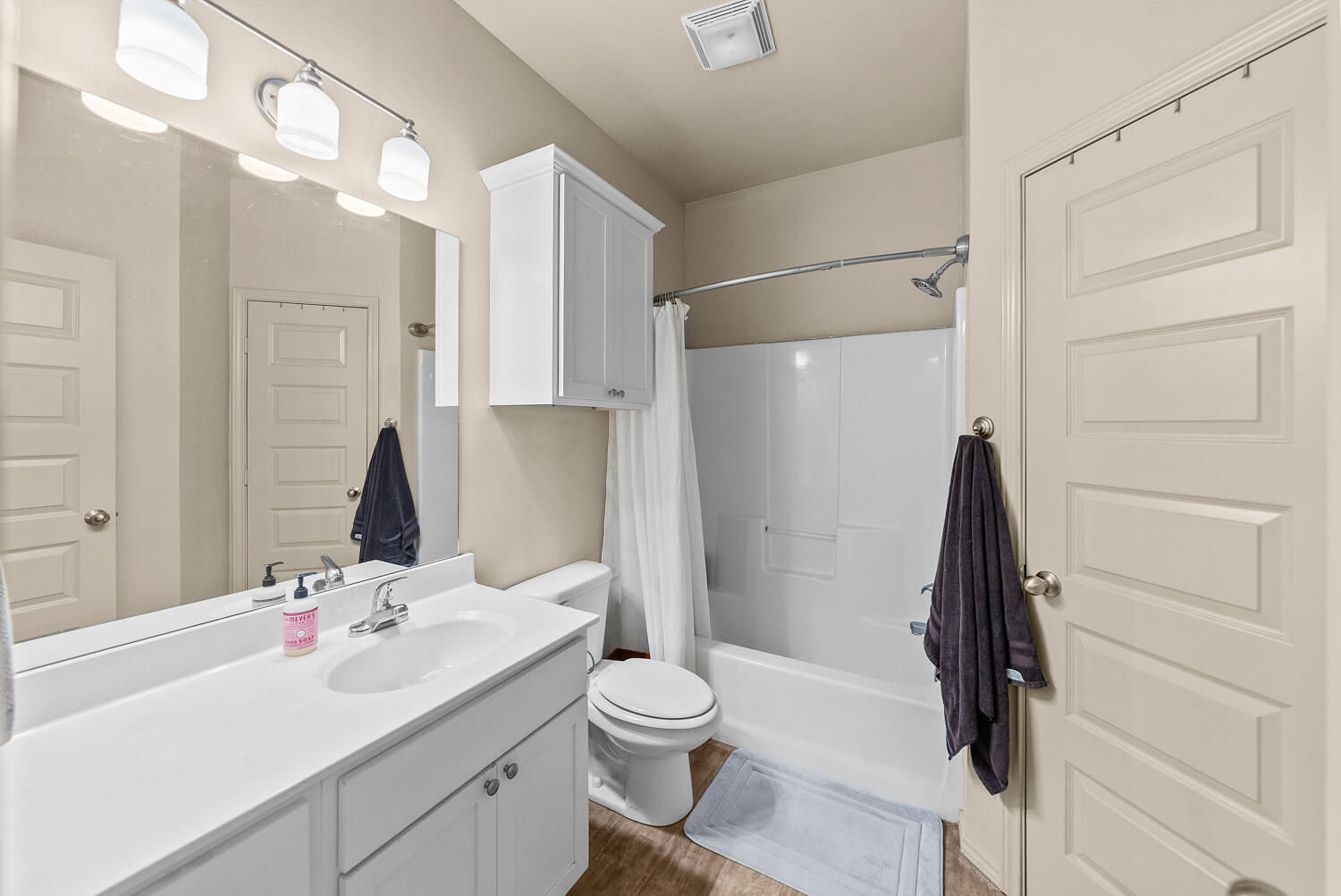 2128 10th Street Lubbock, TX 79401 - Photo 10 of 23 a bathroom with a sink toilet and shower