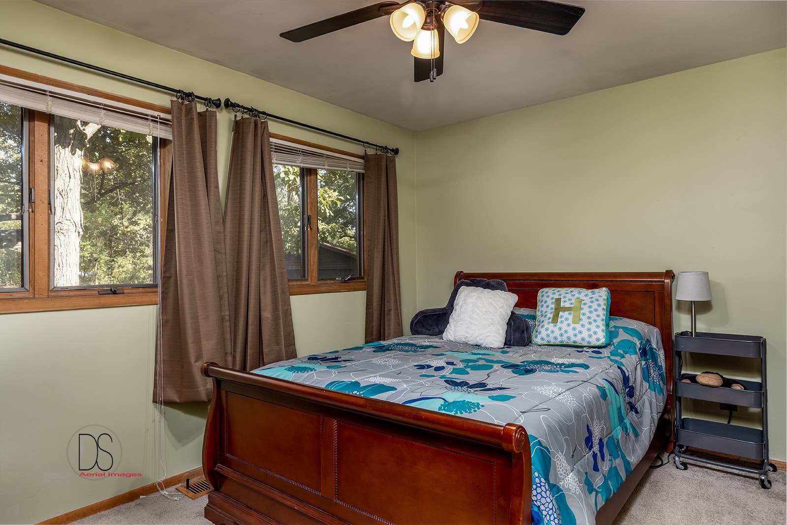 2529 Circle Road Marseilles, IL 61341 - Photo 22 of 36 a bedroom with a large bed and a chandelier
