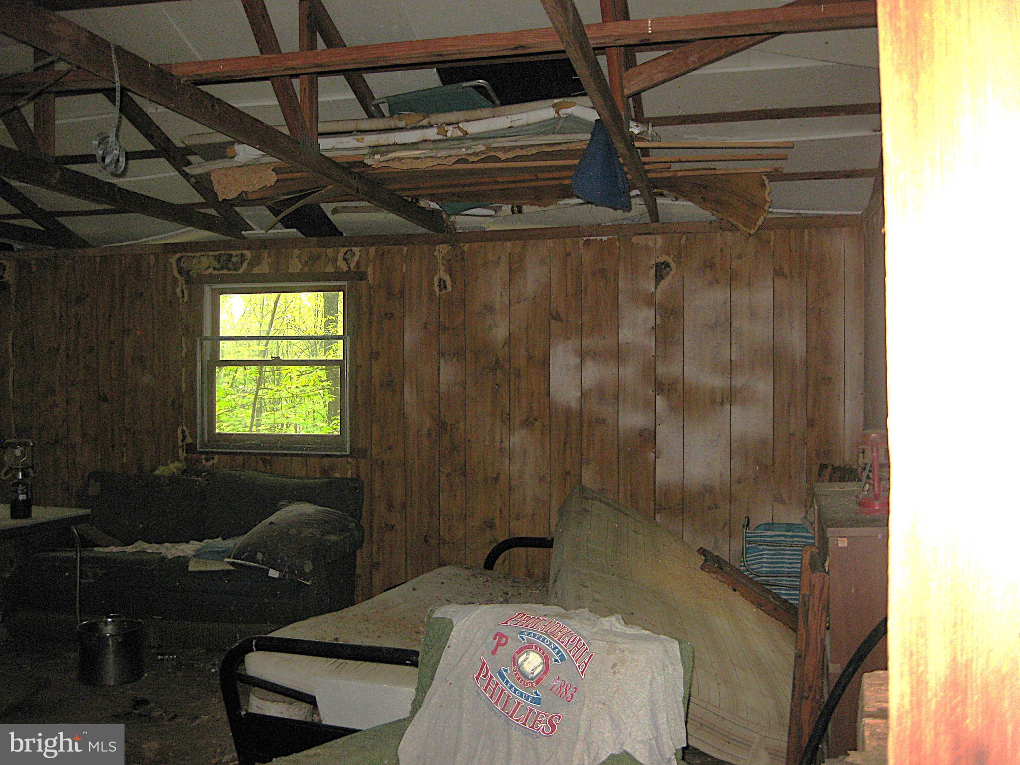 20526 Laurel Mountain Road Three Springs, PA 17264 - Photo 11 of 15 a bedroom with a bed and a window