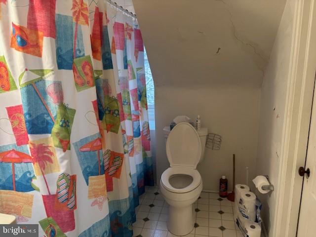 506 Trinity Place Ambler, PA 19002 - Photo 15 of 29 a bathroom with a toilet and a shower curtain