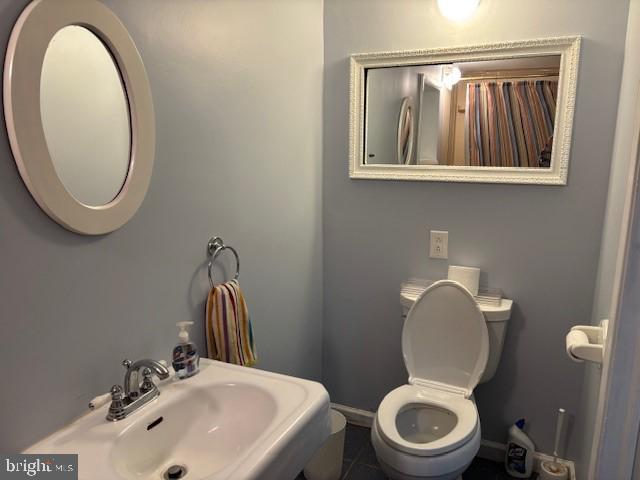 506 Trinity Place Ambler, PA 19002 - Photo 28 of 29 a bathroom with a toilet a sink and a mirror