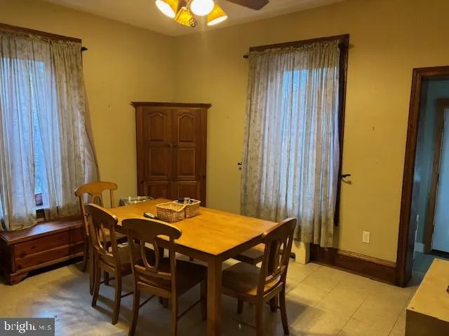 a dining room with a table and chairs