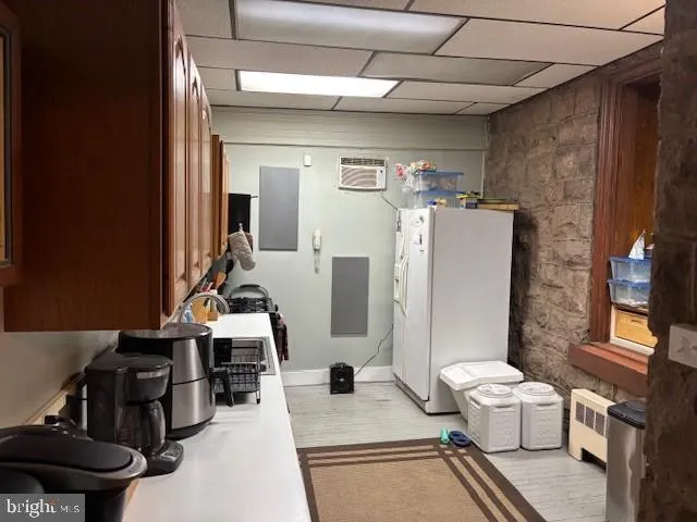 a work room with furniture and a fireplace