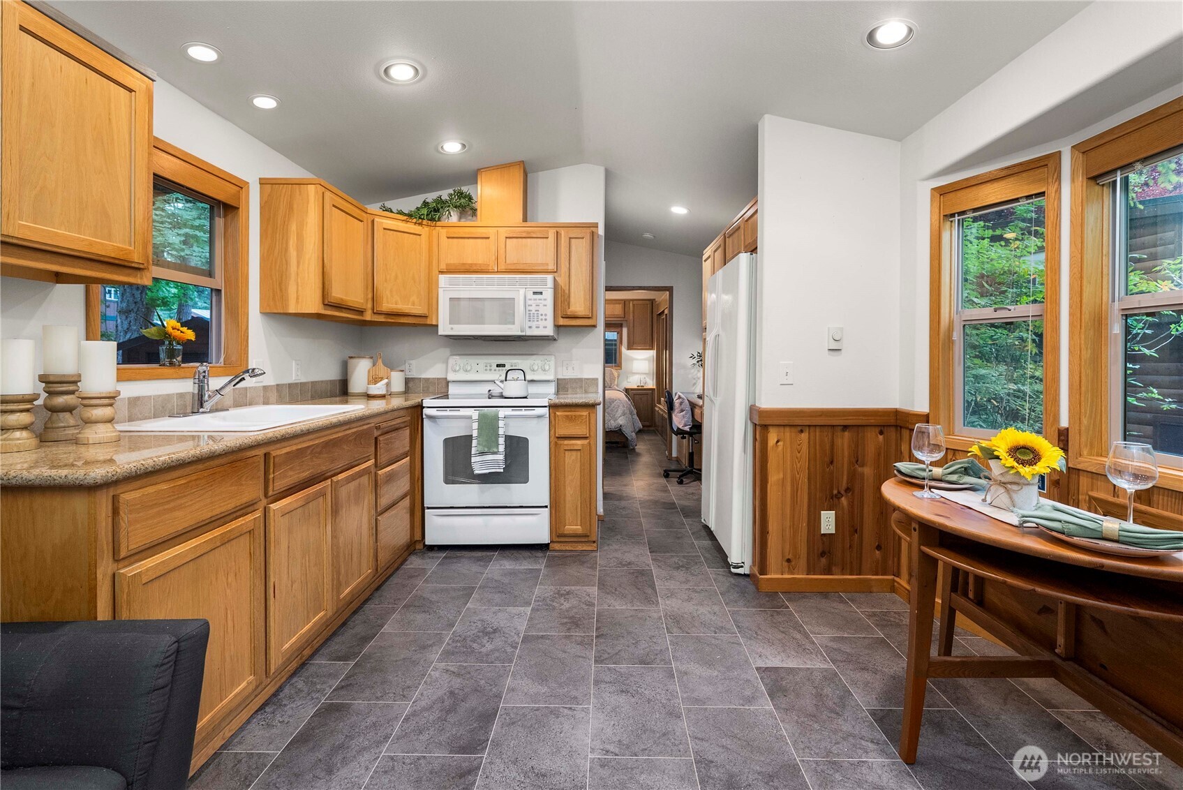 1546 Reservation Road Southeast, Unit 62 Olympia, WA 98513 - Photo 6 of 39 a kitchen with a sink appliances and cabinets