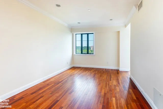 a view of a kitchen with wooden floor and a sink