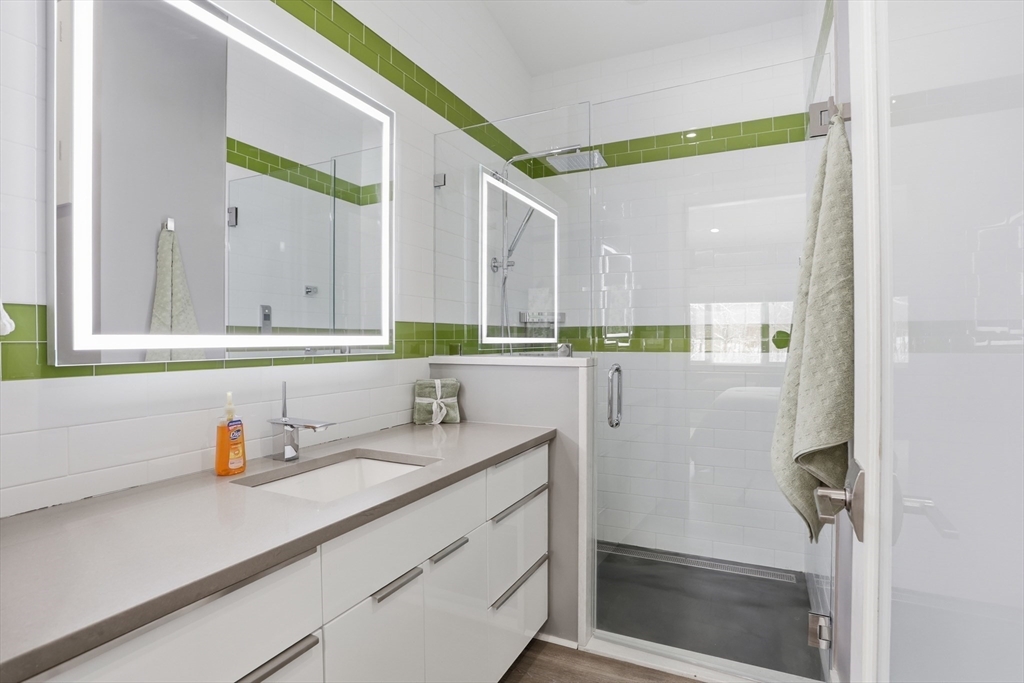 235 Kemp Street Dunstable, MA 01827 - Photo 23 of 42 a bathroom with a sink and a mirror