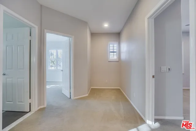 a view of an empty room and closet area