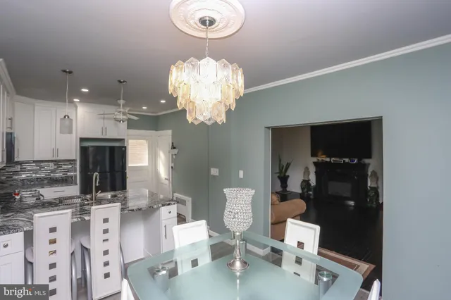 a very nice looking dining room with a table and chairs