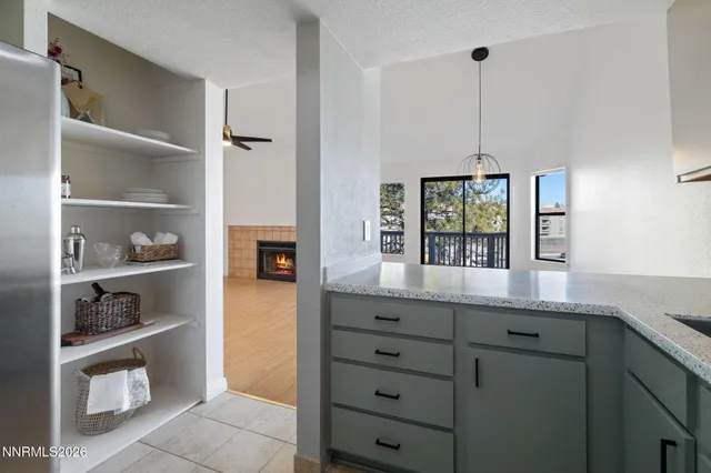 a kitchen with cabinets and window