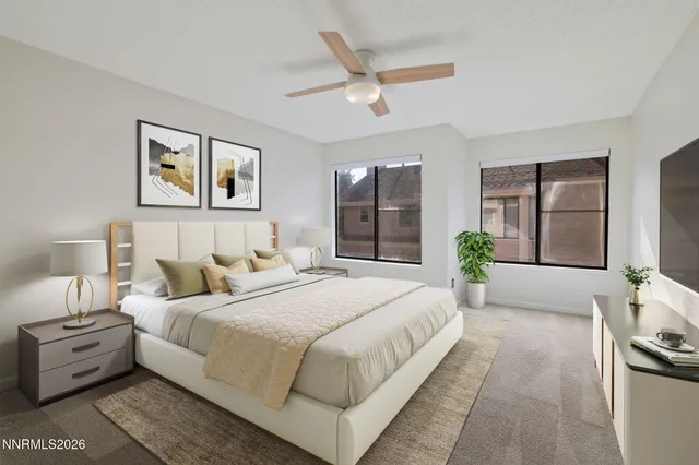 a spacious bedroom with a bed and a dresser