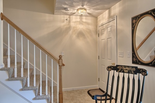159 Allen Road, Unit 28 Billerica, MA 01821 - Photo 4 of 28 a view of a hallway with staircase