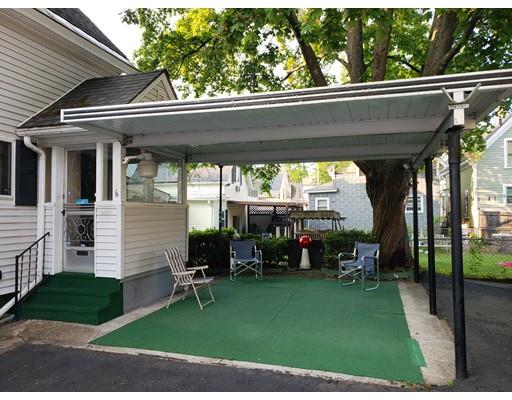 6 Arthur Avenue Lowell, MA 01854 - Photo 3 of 8 a view of a porch with chairs and backyard